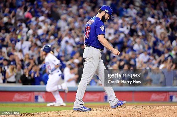 Justin Turner of the Los Angeles Dodgers rounds the bases after he hits a solo home run in the sixth inning off Jake Arrieta of the Chicago Cubs in...