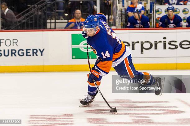 New York Islanders Denfenseman Thomas Hickey takes a shot on goal during the second period of a NHL game between the San Jose Sharks and the New York...