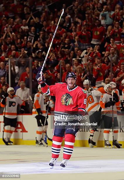 Marian Hossa of the Chicago Blackhawks acknowleges the crowd after scoring his 500th career goal in the second period against the Philadelphia Flyers...