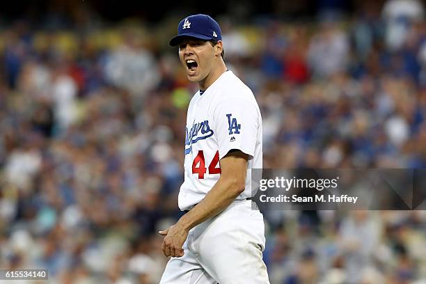 Rich Hill of the Los Angeles Dodgers reacts while taking on the Chicago Cubs in game three of the National League Championship Series at Dodger...