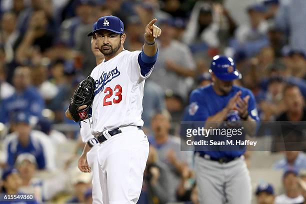 Adrian Gonzalez of the Los Angeles Dodgers calls for a replay on a close call at first base against the Chicago Cubs in game three of the National...