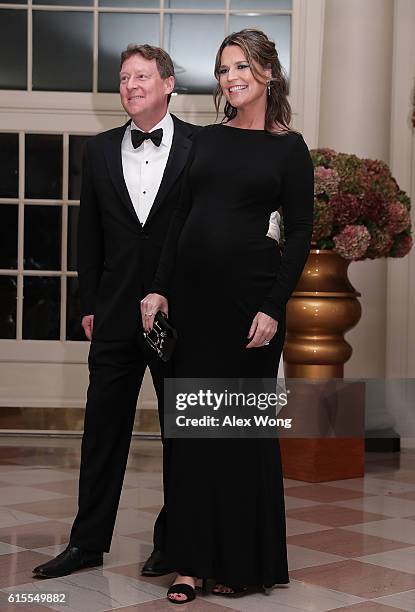 S Today Show co-host Savannah Guthrie and her husband Michael Feldman arrive at the White House for a state dinner October 18, 2016 in Washington,...