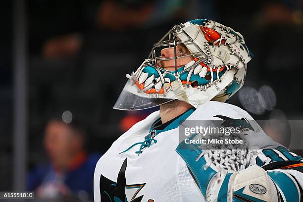 Aaron Dell of the San Jose Sharks looks on against the New York Islanders at the Barclays Center on October 18, 2016 in Brooklyn borough of New York...