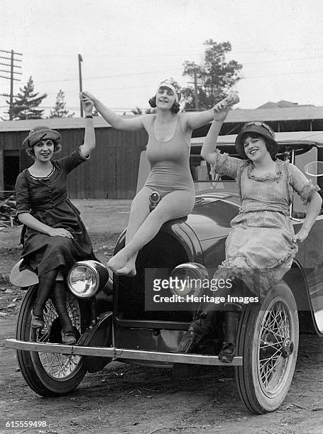 Kissel 6 circa 1922 with ladies on car. Artist Unknown.
