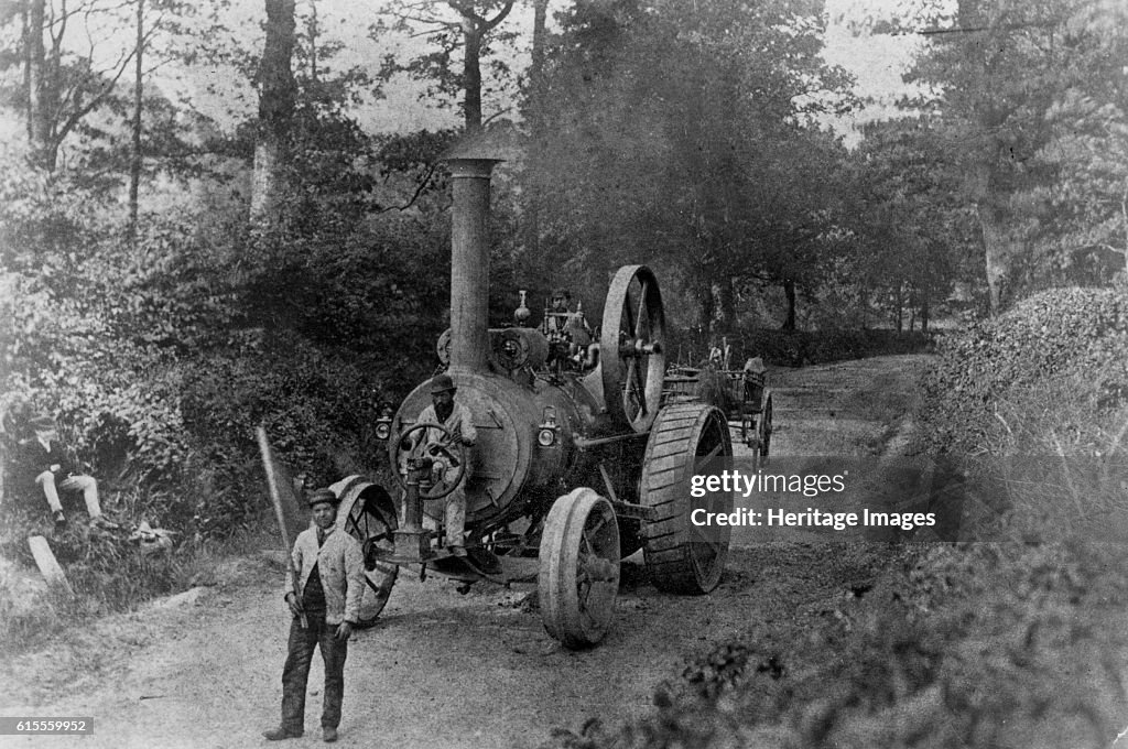Tasker Traction Engine Tasker traction engine with red flag man at the front. Artist Photo d ...
