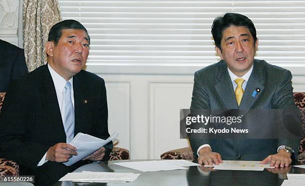 Japan - Shinzo Abe , president of the main opposition Liberal Democratic Party, and LDP Secretary General Shigeru Ishiba attend a meeting of party...