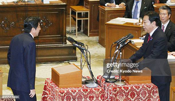 Japan - Photo shows Japanese Prime Minister Yoshihiko Noda and Shinzo Abe , president of the main opposition Liberal Democratic Party, during their...