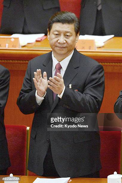 China - Chinese Vice President Xi Jinping claps during the concluding session of the 18th National Congress of the Communist Party of China at the...