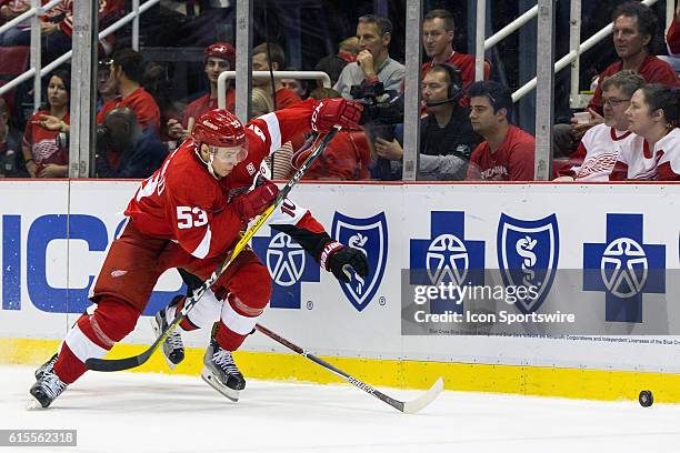 Detroit Red Wings defenseman Alexei Marchenko, of Russia, chases after the puck during the regular season home opener NHL hockey game between the...