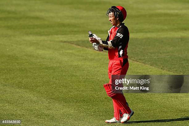 Tom Cooper of the Redbacks takes a drinks break during the Matador BBQs One Day Cup match between South Australia and Tasmania at Hurstville Oval on...