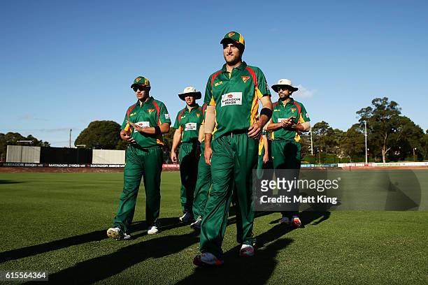 Cameron Stevenson of the Tigers leads the Tigers off the field after taking 5 wickets and victory during the Matador BBQs One Day Cup match between...