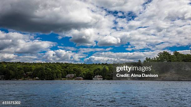 cloudy sky on muskoka lakes - alma danison stock pictures, royalty-free photos & images