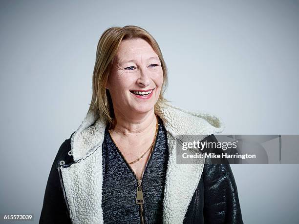 mature female laughing - parka stock pictures, royalty-free photos & images