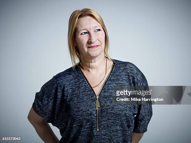 portrait of mature blonde female - real people serious not looking at camera not skiny stock pictures, royalty-free photos & images