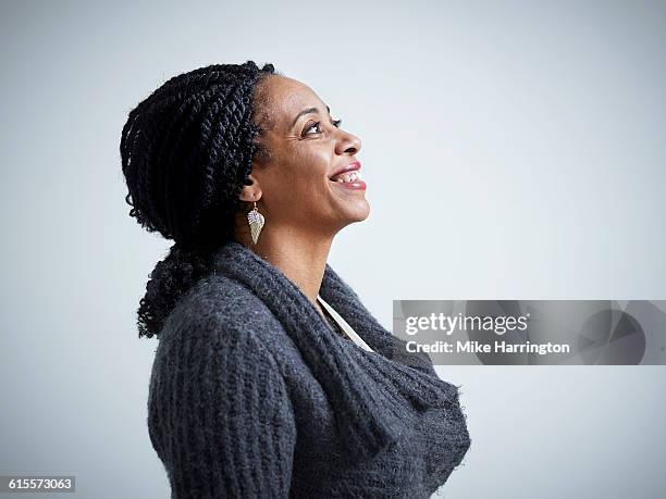 profile of mature female smiling - side profile stock pictures, royalty-free photos & images