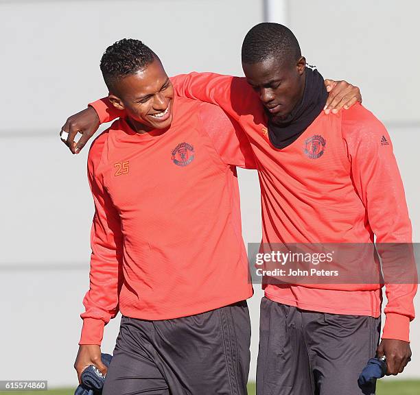 Antonio Valencia and Eric Bailly of Manchester United walk out ahead of a first team training session at Aon Training Complex on October 19, 2016 in...