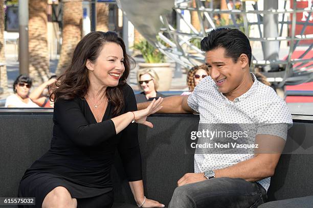 Fran Drescher and Mario Lopez visit "Extra" at Universal Studios Hollywood on October 18, 2016 in Universal City, California.