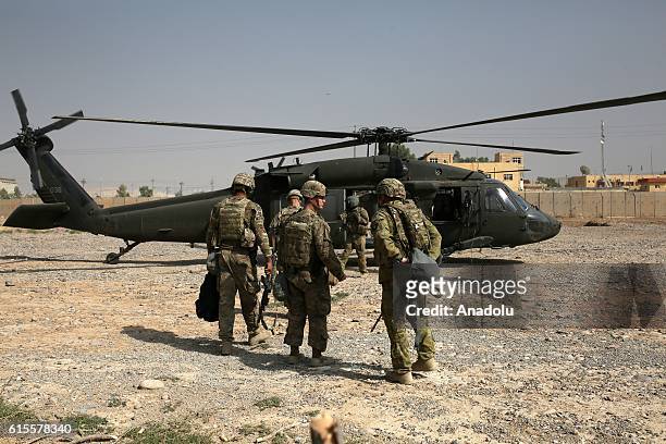 Soldiers leave Nineveh Joint Operations Command Headquarters with helicopters to go to Al-Kayyara district and around Mosul, in Nineveh, Iraq on...