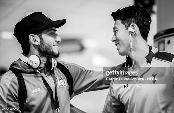 Hakan Calhanoglu of Leverkusen talks to Heung-Min Son of Tottenham in the player tunnel prior to the UEFA Champions League match between Bayer 04...