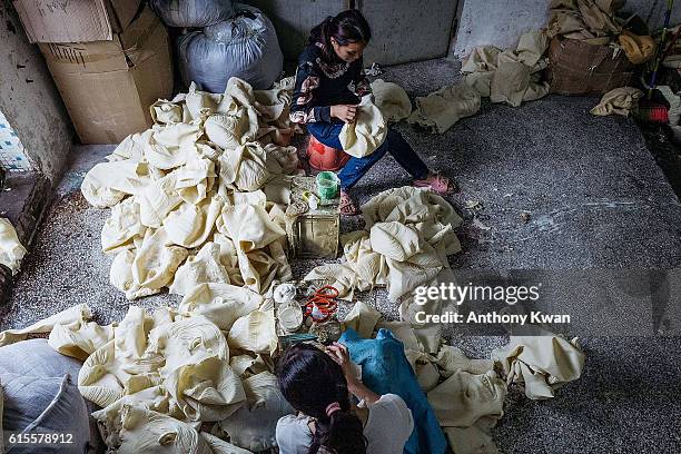 Workers inspect newly-made masks of Donald Trump at the Shenzhen Lanbingcai Latex Crafts Factory on October 18, 2016 in Shenzhen, China. Shenzhen...