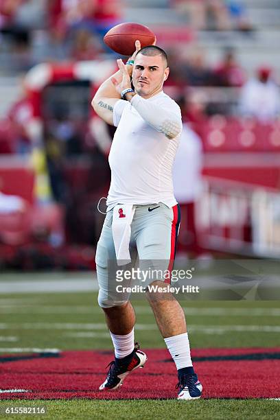 Chad Kelly of the Mississippi Rebels warming up before a game against the Arkansas Razorbacks at Razorback Stadium on October 15, 2016 in...