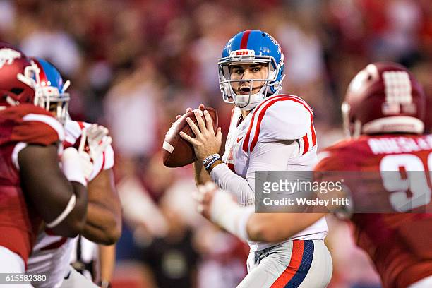 Chad Kelly of the Mississippi Rebels drops back to pass during a game against the Arkansas Razorbacks at Razorback Stadium on October 15, 2016 in...
