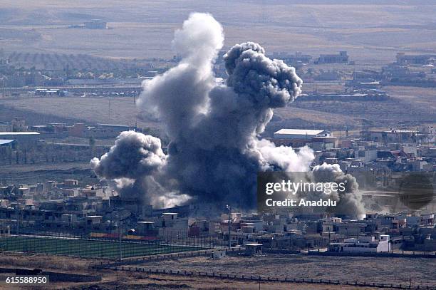 Smoke rises from Daesh terrorists' targets at Bashiqa town following coalitions forces airstrike during the operation to retake Iraq's Mosul from...