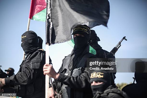 Members of Al-Quds Brigades, armed wing of Palestinian Islamic Jihad Movement march during a parade, staged to mark 29th foundation anniversary of...