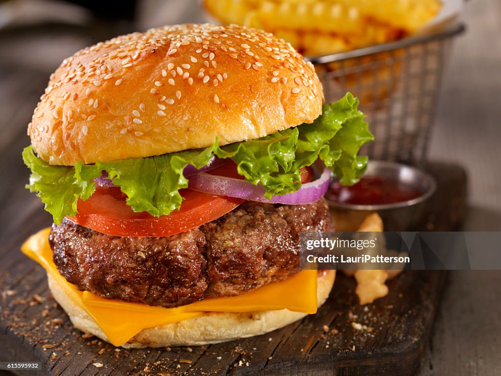 Deluxe Cheeseburger with a Basket of Fries