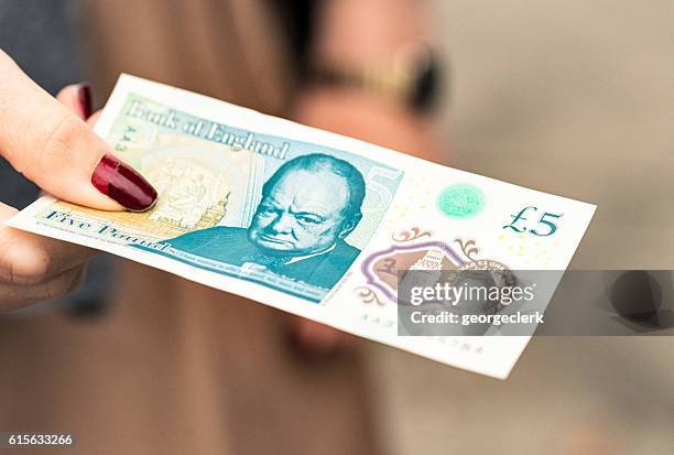 new british £5 polymer banknote - currency symbol stock pictures, royalty-free photos & images