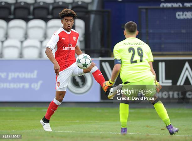 Reiss Nelson of Arsenal controls the ball under pressure froom Daniel Naumov of Ludogorets during the match between Arsenal and Ludogorets Razgrad in...