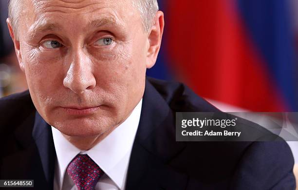 Russian President Vladimir Putin attends a meeting to discuss the Ukrainian peace process at the German federal Chancellery on October 19, 2016 in...
