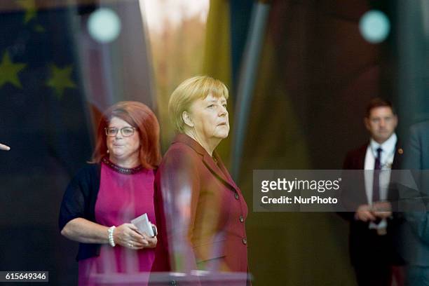 German Chancellor Angela Merkel is pictured as she awaits for the arrival of Ukrainian President Petro Poroshenko before his arrival at the...