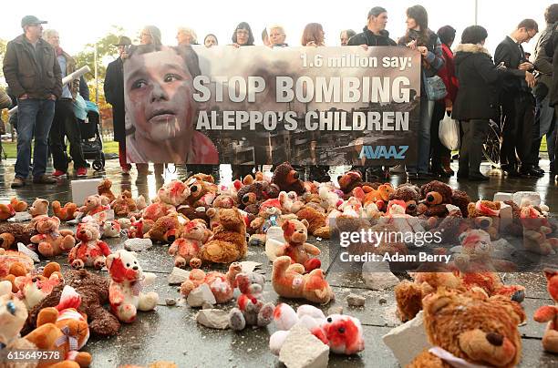 Bloodied teddy bears are seen during a demonstration against Russian military operations in Syria during a visit by Russian President Vladimir Putin...