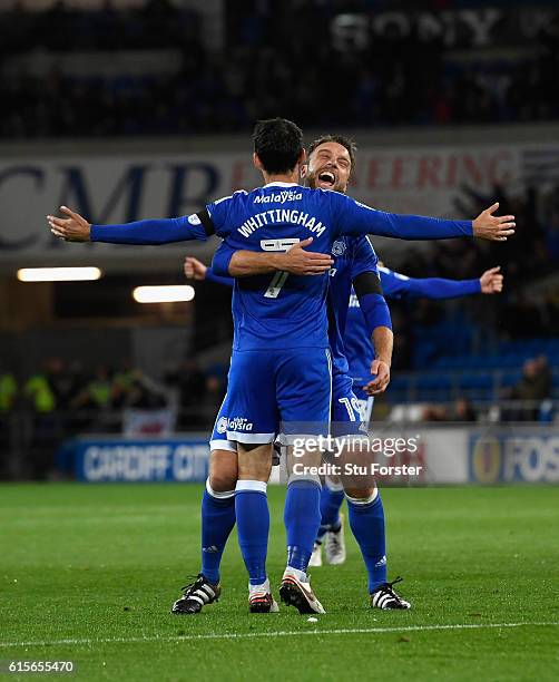 Cardiff player Peter Whittingham is congratulated by Rickie Lambert after scoring the opening goal from a free kick during the Sky Bet Championship...