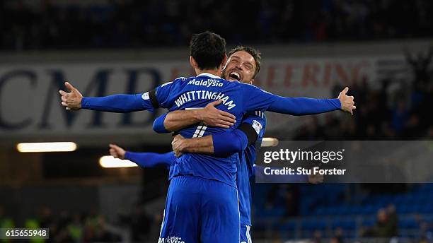 Cardiff player Peter Whittingham is congratulated by Rickie Lambert after scoring the opening goal from a free kick during the Sky Bet Championship...