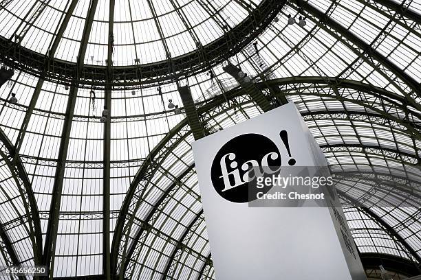 The International Contemporary Art Fair sign is seen inside the Grand Palais on October 22, 2014 in Paris, France. The exhibit is part of the...