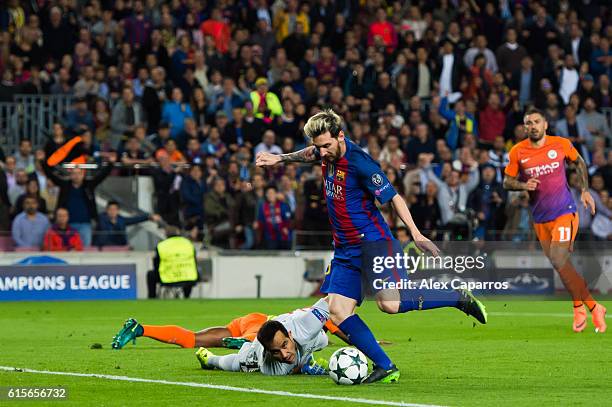 Lionel Messi of FC Barcelona shoots the ball past goalkeeper Claudio Bravo of Manchester City FC and scores the opening goal during the UEFA...