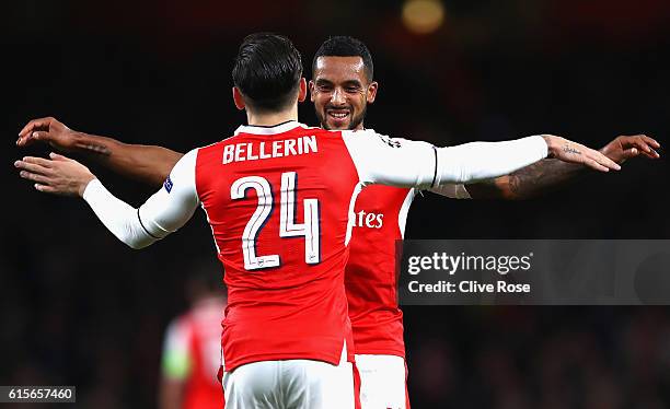 Theo Walcott of Arsenal celebrates with team mate Hector Bellerin during the UEFA Champions League group A match between Arsenal FC and PFC...