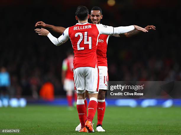 Theo Walcott of Arsenal celebrates with team mate Hector Bellerin during the UEFA Champions League group A match between Arsenal FC and PFC...