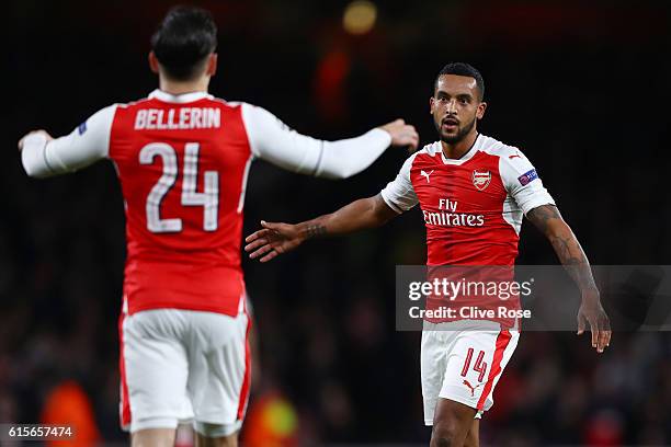 Theo Walcott of Arsenal celebrates with team mate Hector Bellerin during the UEFA Champions League group A match between Arsenal FC and PFC...