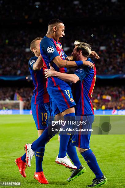 Lionel Messi of FC Barcelona celebrates with his teammates Neymar Santos Jr and Lucas Digne after scoring the opening goal during the UEFA Champions...