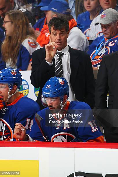 Head Coach Jack Capuano of the New York Islanders looks on from the bench against the Anaheim Ducks at the Barclays Center on October 16, 2016 in...