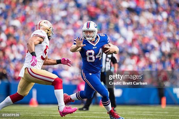 Nick O'Leary of the Buffalo Bills fights off a tackle by Michael Wilhoite of the San Francisco 49ers during the first half on October 16, 2016 at New...