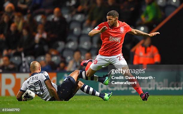 Preston North End's Alex John-Baptiste and Huddersfield Town's Jon Gorenc Stankovic battle for the ball during the Sky Bet Championship match between...