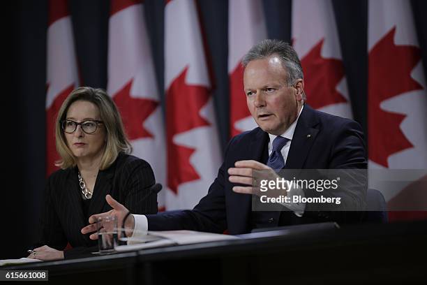 Stephen Poloz, governor of the Bank of Canada, right, speaks as Carolyn Wilkins, senior deputy governor at the Bank of Canada, listens during a news...