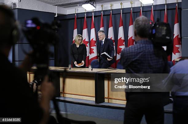 Stephen Poloz, governor of the Bank of Canada, right, and Carolyn Wilkins, senior deputy governor at the Bank of Canada, arrive for a news conference...