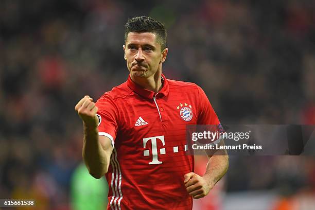 Robert Lewandowski of FC Bayern Muenchen celebrates scoring his team's third goal during the UEFA Champions League match between FC Bayern Muenchen...