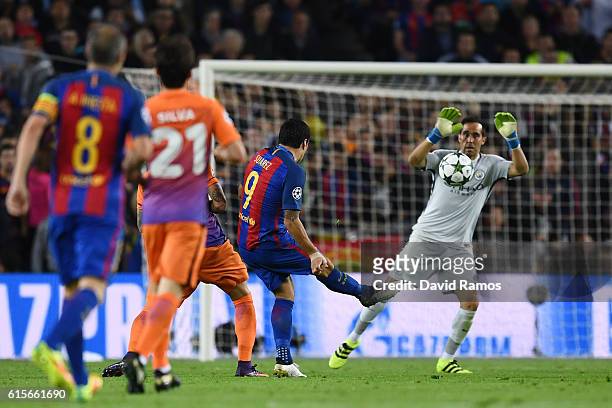 Claudio Bravo of Manchester City handles the shot from Luis Suarez of Barcelona outside of his area during the UEFA Champions League group C match...