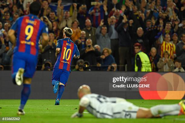 Barcelona's Argentinian forward Lionel Messi celebrates after scoring a goal during the UEFA Champions League football match FC Barcelona vs...